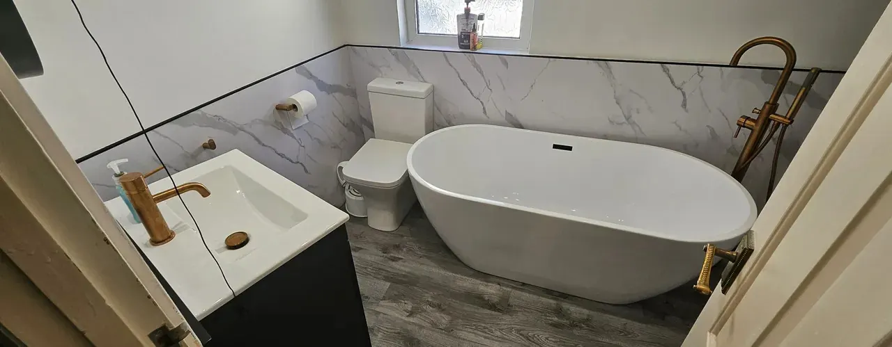 Plumber in Penylan installing a freestanding bath in a renovated family bathroom